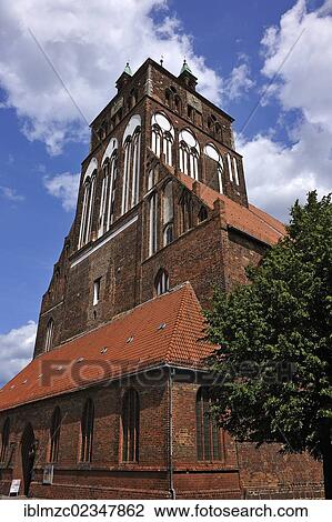 "Steeple of St. Marienkirche church, one of the most important hall churches of the north German brick Gothic, built about 1335, Brueggstrasse street 35, Greifswald, Mecklenburg-Western Pomerania, Germany, Europe" View Large Photo Image Stock Image - "Steeple of St. Marienkirche church, one of the most important hall churches of the north German brick Gothic, built about 1335, Brueggstrasse street 35, Greifswald, Mecklenburg-Western Pomerania, Germany, Europe". Fotosearch
