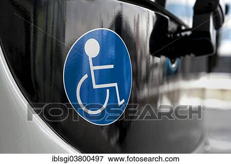 Stock Photo - "Sticker indicating that a bus is accessible for handicapped people, Munich, Bavaria, Germany, Europe". Fotosearch