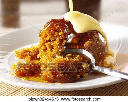Sticky toffee sponge pudding and custard View Large Photo Image Stock Image - Sticky toffee sponge pudding and custard. Fotosearch