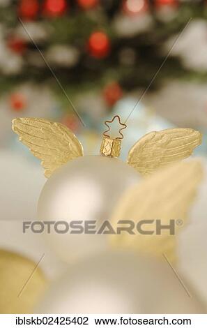 "Still life, Christmas baubles with golden wings" View Large Photo Image Stock Image - "Still life, Christmas baubles with golden wings". Fotosearch