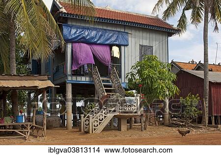 Picture - "Stilt house on the banks of the Mekong River, Pre Kolam, Kompong Lung Province, Cambodia, Asia". Fotosearch