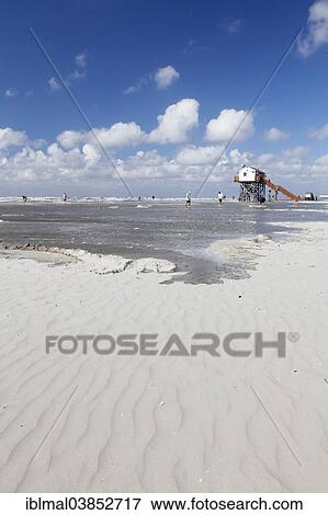 Stock Photo - "Stilt house on the beach at high tide, St. Peter-Ording, Eiderstedt, Schleswig-Holstein, Germany, Europe". Fotosearch