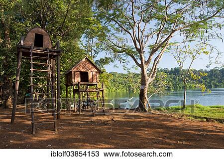 "Stilt houses of the Kroeung people, batchelor house built on stilts, on the shore of the volcanic lake Yak Loam, Yeak Laom, Beung Yeak Loam, Banlung, Ratanakiri Province, Cambodia, Asia" View Large Photo Image Stock Image - "Stilt houses of the Kroeung people, batchelor house built on stilts, on the shore of the volcanic lake Yak Loam, Yeak Laom, Beung Yeak Loam, Banlung, Ratanakiri Province, Cambodia, Asia". Fotosearch