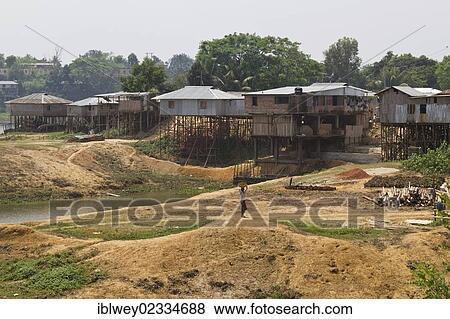 "Stilt houses on the bank of the Kaptai Lake reservoir, Rangamati, Chittagong Hill Tracts, Bangladesh, South Asia, Asia" View Large Photo Image Stock Photo - "Stilt houses on the bank of the Kaptai Lake reservoir, Rangamati, Chittagong Hill Tracts, Bangladesh, South Asia, Asia". Fotosearch