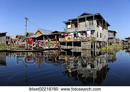 "Stilt houses with reflections on Lake Inle, Burma also known as Myanmar, Southeast Asia, Asia" View Large Photo Image Stock Image - "Stilt houses with reflections on Lake Inle, Burma also known as Myanmar, Southeast Asia, Asia". Fotosearch