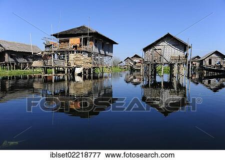 "Stilt houses with reflections on Lake Inle, Burma also known as Myanmar, Southeast Asia, Asia" View Large Photo Image Stock Photo - "Stilt houses with reflections on Lake Inle, Burma also known as Myanmar, Southeast Asia, Asia". Fotosearch