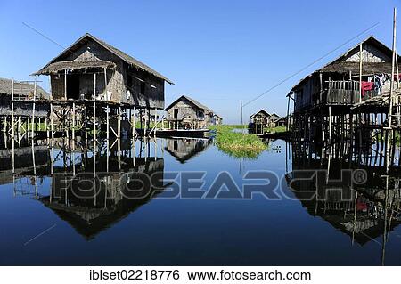 "Stilt houses with reflections on Lake Inle, Burma also known as Myanmar, Southeast Asia, Asia" View Large Photo Image Stock Photograph - "Stilt houses with reflections on Lake Inle, Burma also known as Myanmar, Southeast Asia, Asia". Fotosearch