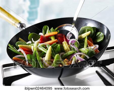 Stirfry vegetables being cooked in a wok View Large Photo Image Stock Photography - Stirfry vegetables being cooked in a wok. Fotosearch