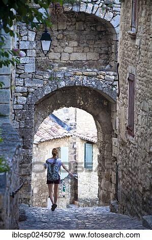 Stock Image - "Stone arc in an alleyway, Lacoste village, Vaucluse, Provence, France, Europe". Fotosearch