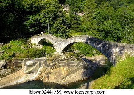 "Stone bridge across rocky alpine foothills stream in the remote valley of Val Verzasca, near Lavertezzo, Ticino, Switzerland, Europe" View Large Photo Image Stock Photo - "Stone bridge across rocky alpine foothills stream in the remote valley of Val Verzasca, near Lavertezzo, Ticino, Switzerland, Europe". Fotosearch