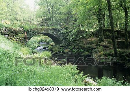 Stock Photo - "Stone bridge and river, Parc Naturel Regional de Millevaches en Limousin, Regional Natural Park of Millevaches en Limousin, Correze, France, Europe". Fotosearch