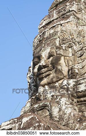 Stock Image - "Stone face of Avalokiteshvara, Bayon temple, Angkor Thom, Angkor, Siem Reap, Cambodia, Asia". Fotosearch