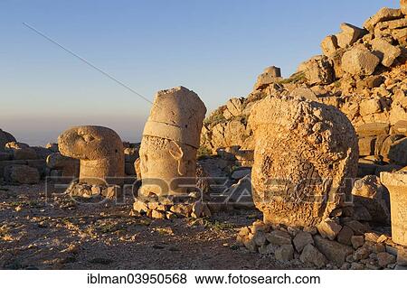 Stock Photo - "Stone heads of an eagle, Antiochos and Tyche of Commagene, East Terrace, grave of Antiochus, Nemrut Mountain, Nemrut Dagi, Adiyaman Province, Southeastern Anatolia Region, Anatolia, Turkey, Asia". Fotosearch
