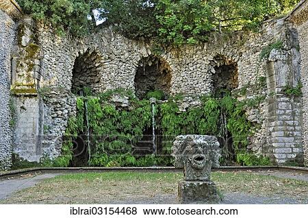 "Stone mask with four heads at the grotto of the water source, Fontana del Diluvio, flood fountain, garden of Villa Lante, Bagnaia, Lazio, Italy, Europe" View Large Photo Image Stock Photo - "Stone mask with four heads at the grotto of the water source, Fontana del Diluvio, flood fountain, garden of Villa Lante, Bagnaia, Lazio, Italy, Europe". Fotosearch