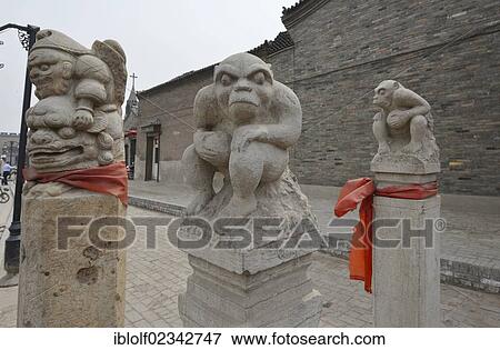 Stock Photo - "Stone sculptures in the form of monkeys and demons, historic city centre of Pingyao, UNESCO World Heritage Site, Shanxi, China, Asia". Fotosearch