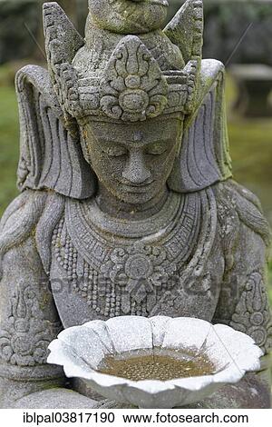 Stock Image - "Stone statue, figure, Buddhist Mendut Monastery, Mendut, Central Java, Indonesia, Asia". Fotosearch