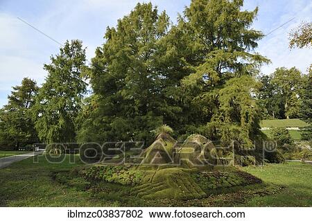 Stock Image - "Stone statues overgrown with moss, Mainau, Baden-Wurttemberg, Germany, Europe". Fotosearch