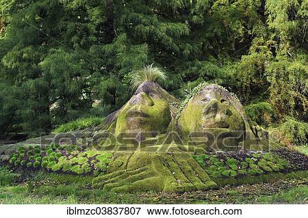 Stock Photo - "Stone statues overgrown with moss, Mainau, Baden-Wurttemberg, Germany, Europe". Fotosearch