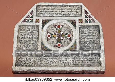 Stock Image - "Stone with inscriptions in four languages, Greek, Arabic, Hebrew and Latin, exhibit in the Norman Castle of La Zisa, Zisa Castle, Palermo, Sicily, Italy, Europe". Fotosearch