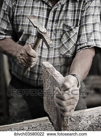 "Stonemason working on a stone slab with a hammer, Reith im Alpbachtal, Kufstein District, North Tirol, Tirol, Austria, Europe" View Large Photo Image Stock Image - "Stonemason working on a stone slab with a hammer, Reith im Alpbachtal, Kufstein District, North Tirol, Tirol, Austria, Europe". Fotosearch
