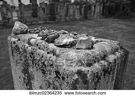 Stock Photography - "Stones lying on a headstone as a sign of remembrance, headstone with the names of the murdered Jews of Schnaittach during the Nazi era, third Jewish cemetery of 1897, Schnaittach, Middle Franconia, Bavaria, Germany, Europe". Fotosearch