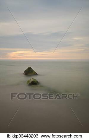 "Stones on the west coast of Ruegen at sunset, long exposure, Dranske, Mecklenburg-Western Pomerania, Germany, Europe" View Large Photo Image Stock Image - "Stones on the west coast of Ruegen at sunset, long exposure, Dranske, Mecklenburg-Western Pomerania, Germany, Europe". Fotosearch