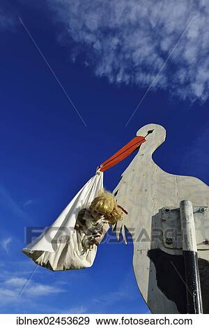 "Stork bringing a baby, wooden figure, Tannberg Mountain, Koestendorf, Lake Waller, Salzburg Lakes District, Salzburg, Austria, Europe" View Large Photo Image Stock Photo - "Stork bringing a baby, wooden figure, Tannberg Mountain, Koestendorf, Lake Waller, Salzburg Lakes District, Salzburg, Austria, Europe". Fotosearch