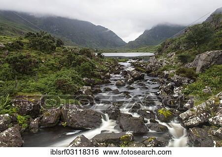 "Stream flowing through a misty landscape, Gap of Dunloe, County Kerry, Ireland, Europe" View Large Photo Image Stock Photograph - "Stream flowing through a misty landscape, Gap of Dunloe, County Kerry, Ireland, Europe". Fotosearch