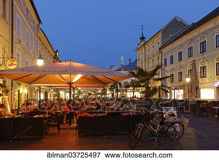 "Street cafe in the pedestrian zone, Alter Platz square, historic center, Klagenfurt, Carinthia, Austria, Europe" View Large Photo Image Stock Photo - "Street cafe in the pedestrian zone, Alter Platz square, historic center, Klagenfurt, Carinthia, Austria, Europe". Fotosearch
