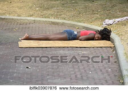 "Street child, girl, asleep in a public place, Rio de Janeiro, Rio de Janeiro State, Brazil, South America" View Large Photo Image Stock Photograph - "Street child, girl, asleep in a public place, Rio de Janeiro, Rio de Janeiro State, Brazil, South America". Fotosearch