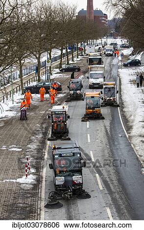 "Street cleaning, municipal cleaning workers cleaning a street after a carnival parade, Essen, North Rhine-Westphalia, Germany, Europe" View Large Photo Image Stock Photograph - "Street cleaning, municipal cleaning workers cleaning a street after a carnival parade, Essen, North Rhine-Westphalia, Germany, Europe". Fotosearch