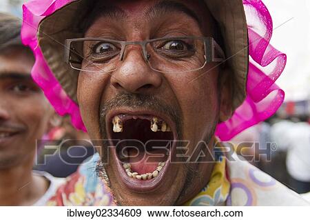 "Street clown opening his mouth at a demonstration against the ruling Awami League to show his broken and missing teeth, Dhaka, Bangladesh, South Asia, Asia" View Large Photo Image Stock Photo - "Street clown opening his mouth at a demonstration against the ruling Awami League to show his broken and missing teeth, Dhaka, Bangladesh, South Asia, Asia". Fotosearch