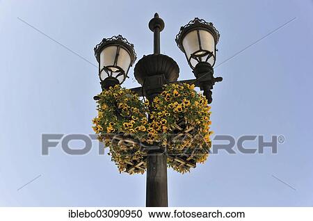 Stock Image - "Street lanterns decorated with flowers, Granada, Granada province, Andalusia, Spain, Europe". Fotosearch