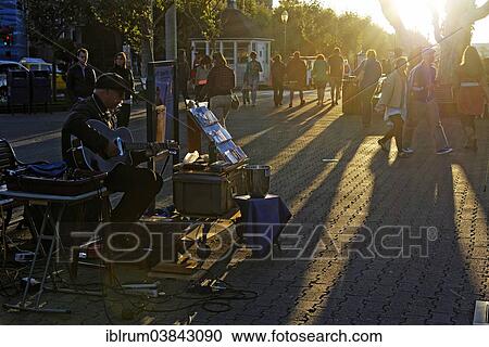 "Street musician playing at the Fisherman Wharf in the evening light, San Francisco, California, USA" View Large Photo Image Stock Image - "Street musician playing at the Fisherman Wharf in the evening light, San Francisco, California, USA". Fotosearch