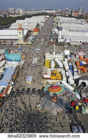 "Street of the beer tents with the shadow of the Ferris wheel, Oktoberfest festival, Munich, Upper Bavaria, Bavaria, Germany, Europe" View Large Photo Image Stock Photography - "Street of the beer tents with the shadow of the Ferris wheel, Oktoberfest festival, Munich, Upper Bavaria, Bavaria, Germany, Europe". Fotosearch