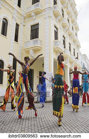 "Street performers walking on stilts in Old Havana, Havana, Cuba, North America" View Large Photo Image Stock Image - "Street performers walking on stilts in Old Havana, Havana, Cuba, North America". Fotosearch