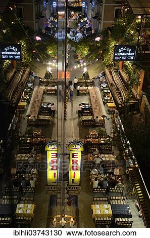 Stock Image - "Street restaurants along the road of Ibni Kemal Caddesi, mirroring, Sirkeci, Istanbul, European side, Istanbul Province, Turkey, European side, Europe". Fotosearch