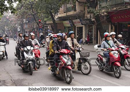 Stock Photo - "Street scene, moped riders on mopeds, Hanoi, North Vietnam, Vietnam, Asia". Fotosearch