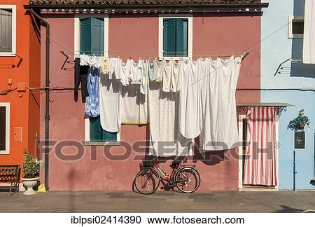 Street scene with laundry and bicycle, Burano, Venice, Veneto, Italy, Europe View Large Photo Image Stock Image - Street scene with laundry and bicycle, Burano, Venice, Veneto, Italy, Europe. Fotosearch