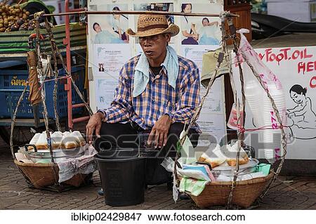 "Street vendor selling small snacks, Bangkok, Thailand, Asia" View Large Photo Image Stock Photo - "Street vendor selling small snacks, Bangkok, Thailand, Asia". Fotosearch