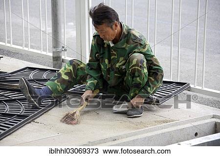 Stock Image - "Street worker, Tiananmen Platz, Beijing, China, People's Republic of China, Asia". Fotosearch