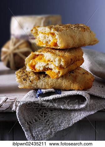 Stromboli bread filled with cheese View Large Photo Image Stock Image - Stromboli bread filled with cheese. Fotosearch