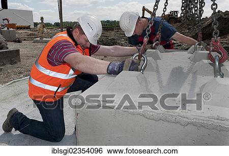 "Structural engineers placing first blocks during a building site load test, at a construction site in Fridolfing, Bavaria, Germany, Europe" View Large Photo Image Stock Photograph - "Structural engineers placing first blocks during a building site load test, at a construction site in Fridolfing, Bavaria, Germany, Europe". Fotosearch