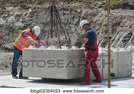 "Structural engineers placing the first blocks during a building site load test, at a construction site in Fridolfing, Bavaria, Germany, Europe" View Large Photo Image Stock Image - "Structural engineers placing the first blocks during a building site load test, at a construction site in Fridolfing, Bavaria, Germany, Europe". Fotosearch