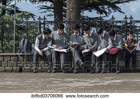 "Students sitting on a wall studying, Shimla, Himachal Pradesh, India, Asia" View Large Photo Image Stock Photograph - "Students sitting on a wall studying, Shimla, Himachal Pradesh, India, Asia". Fotosearch