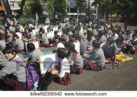 "Students wearing school uniforms attending art lessons in the Botanical Garden, waiting seated for the gate to open, Kyoto, Japan, East Asia, Asia" View Large Photo Image Stock Image - "Students wearing school uniforms attending art lessons in the Botanical Garden, waiting seated for the gate to open, Kyoto, Japan, East Asia, Asia". Fotosearch
