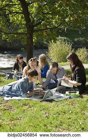 "Students with laptops and books on a meadow, Freiburg im Breisgau, Baden-Wuerttemberg, Germany, Europe" View Large Photo Image Picture - "Students with laptops and books on a meadow, Freiburg im Breisgau, Baden-Wuerttemberg, Germany, Europe". Fotosearch