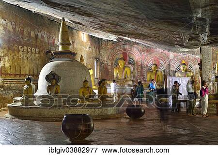 Stock Photo - "Stupa, Buddha statues and murals in one of the cave temples of the Golden Temple, UNESCO World Heritage Site, Dambulla, Central Province, Sri Lanka, Asia". Fotosearch