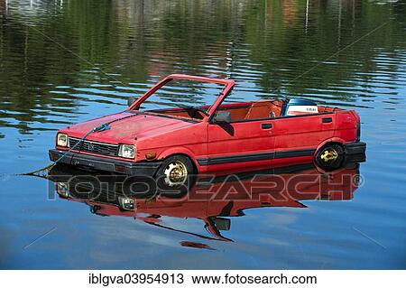 Stock Image - "Subaru car turned into a boat, floating on a lake, Norway, Europe". Fotosearch