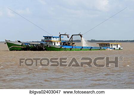 Stock Photo - "Suction dredger operating on the Mekong River, Phnom Penh, Cambodia, Southeast Asia, Asia". Fotosearch